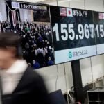 Stock market today: Global shares trade mixed in a muted reaction to the U.S. inauguration