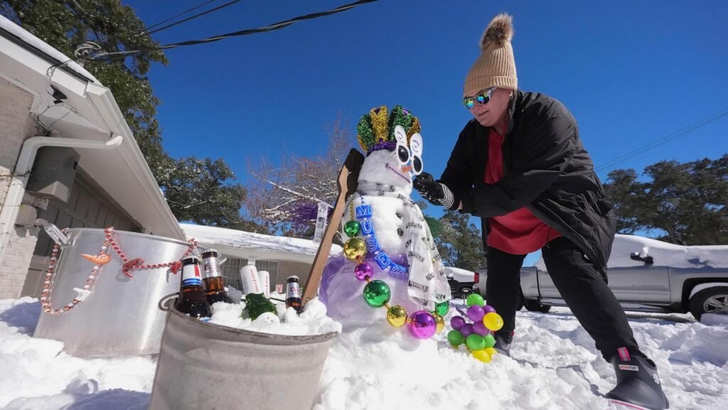 Sledding on boogie boards, ice hockey on Canal Street: The Gulf Coast embraces a rare snow day