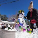 Sledding on boogie boards, ice hockey on Canal Street: The Gulf Coast embraces a rare snow day